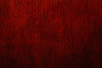 Background photo of a red tapestry with a gradient of colors from red to black. Photo by Bangsal Nam on Unsplash